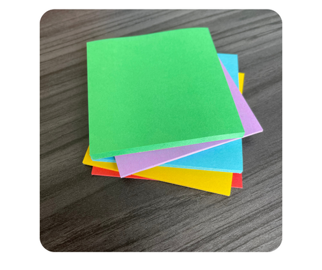 Stack of green, purple, blue, yellow, and red sticky notes.